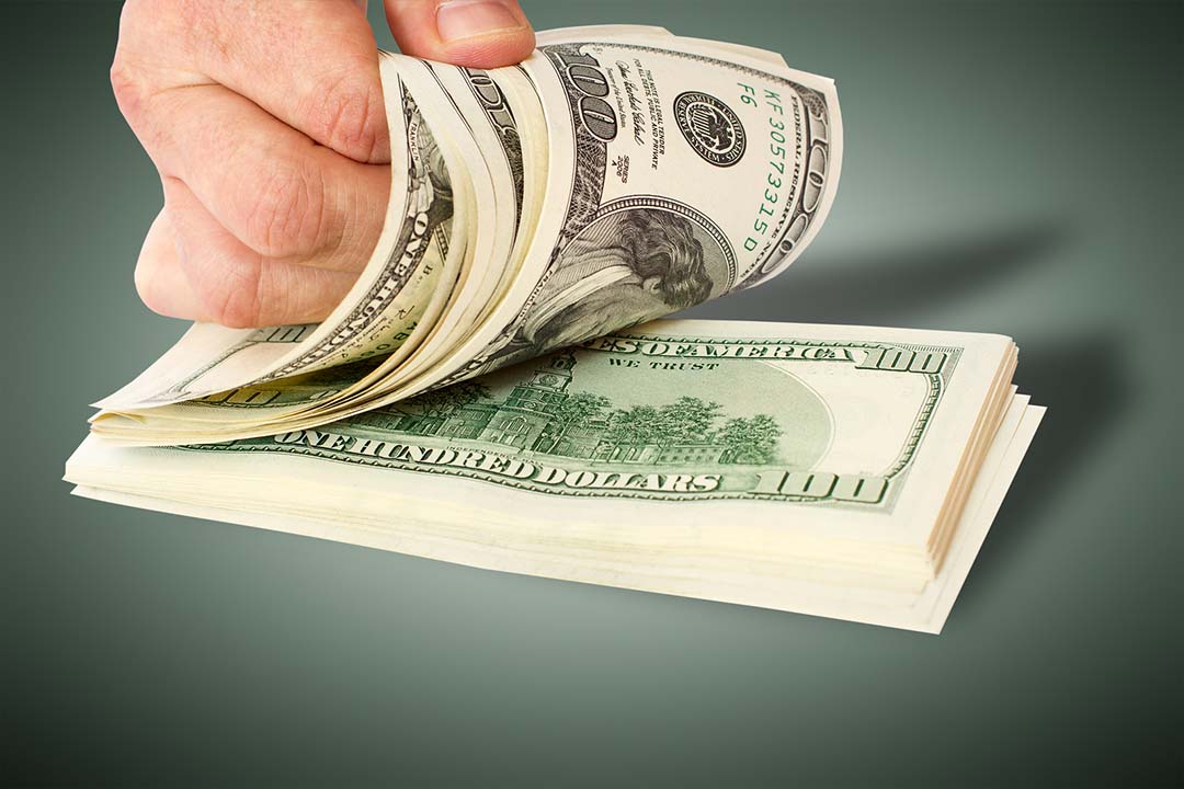 bigstock-businessman-giving-money-cash--60099971-1080.jpg